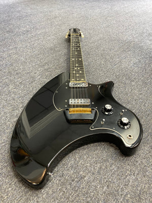 Ovation Deacon 12-String Electric Guitar Black, vintage model with solid body, visible volume knob, and minor wear on headstock and pickguard.
