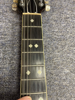 Ovation Deacon 12-String Electric Guitar Black with white diamond inlays on neck, solid body, minor headstock chip, and pickguard crack.