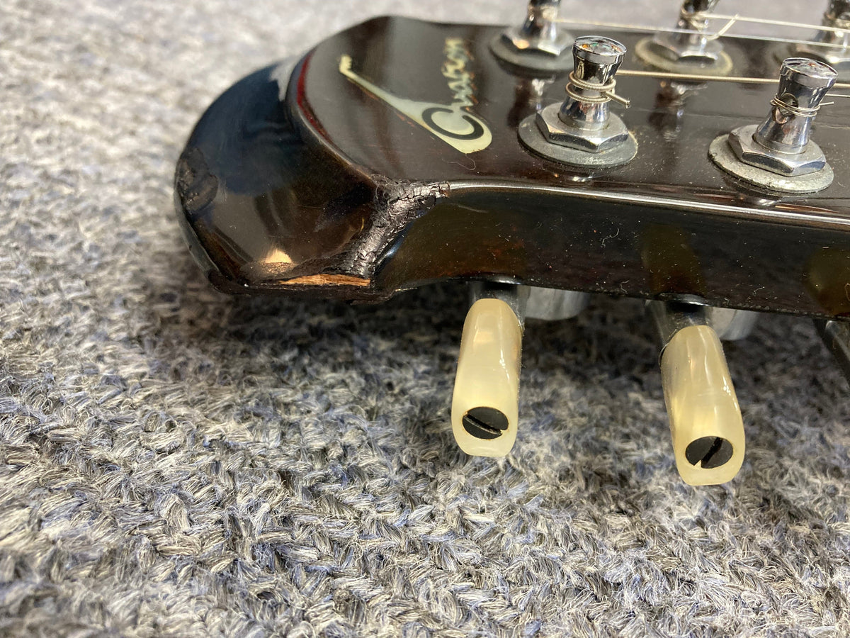 Close-up of the Ovation Deacon 12-String Electric Guitar, showcasing its solid body design and intricate detailing.