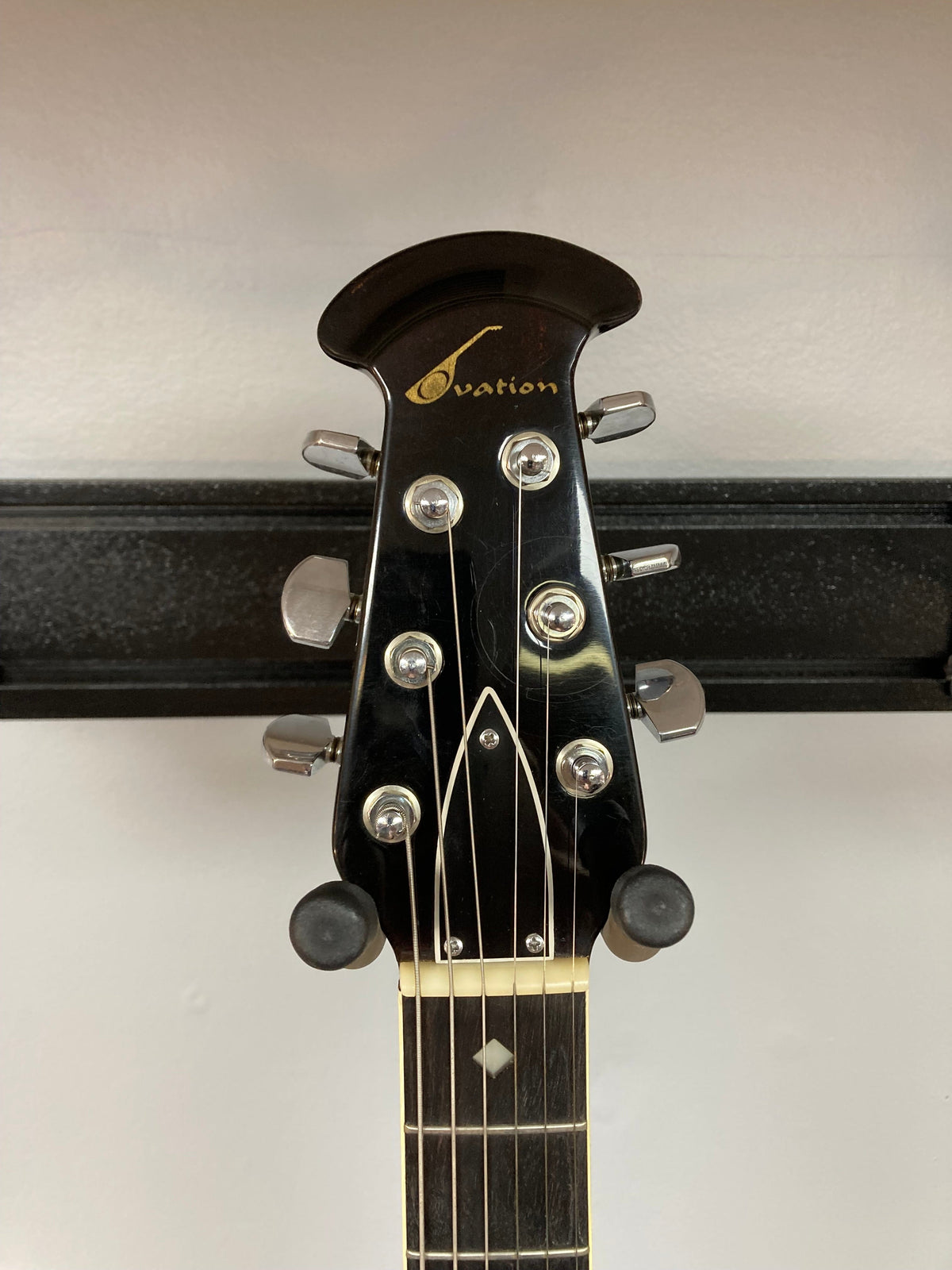 Ovation Deacon 1973-1975 Sunburst Electric Guitar headstock with tuning pegs and minor wear visible.