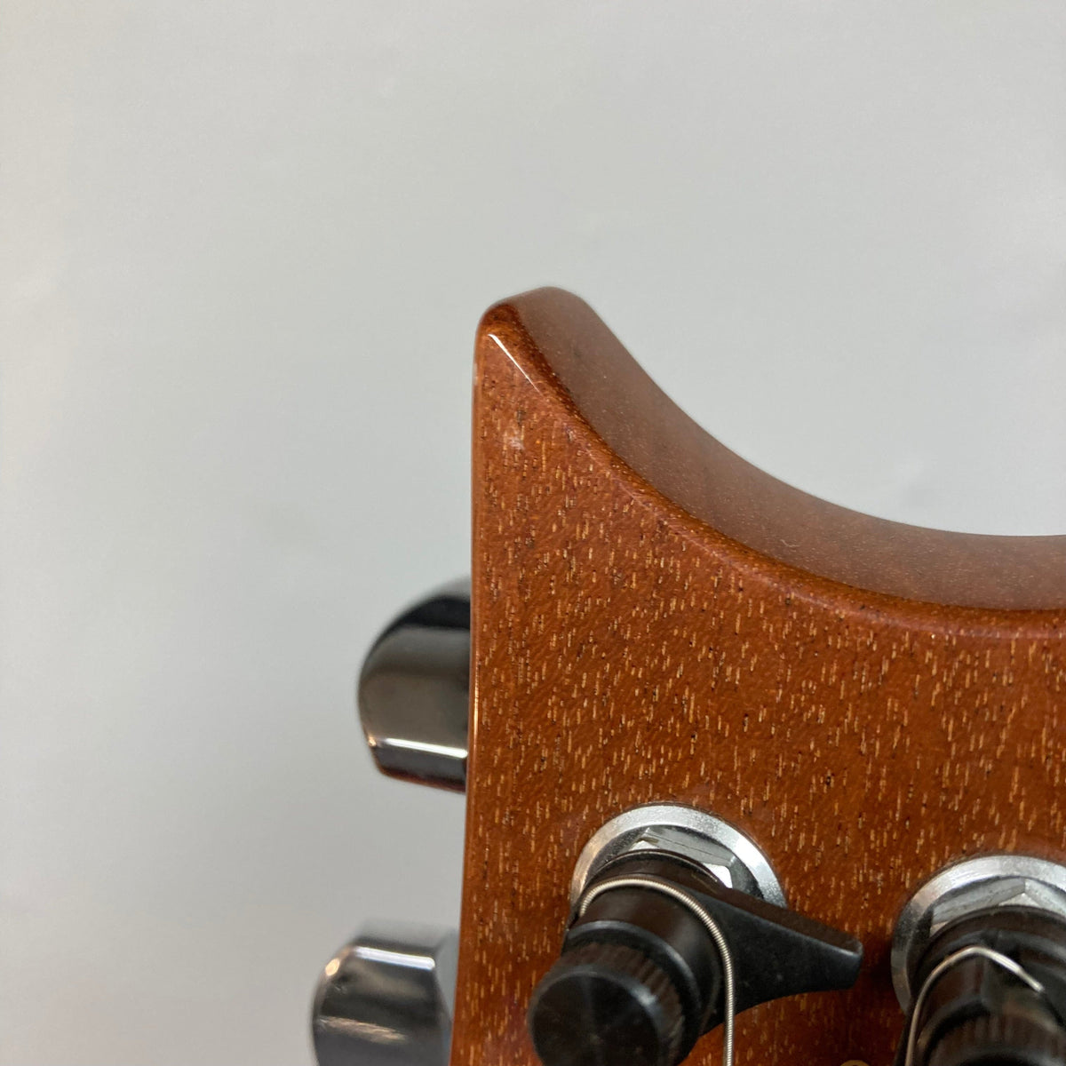 Close-up of PRS 1996 Gold Top guitar, showcasing its lustrous finish and detailed craftsmanship, including strings, frets, and contours. Includes original hard case.