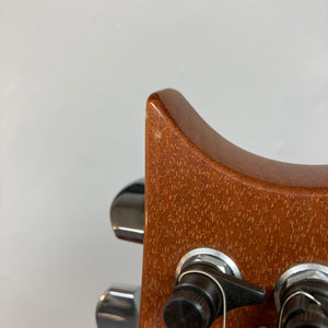 Close-up of PRS 1996 Gold Top guitar, showcasing its lustrous finish and detailed craftsmanship, including strings, frets, and contours. Includes original hard case.