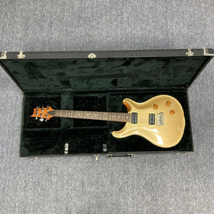 PRS 1996 Gold Top guitar in its original hard case, showcasing its lustrous finish and contoured neck, perfect for versatile tones and supreme playability.