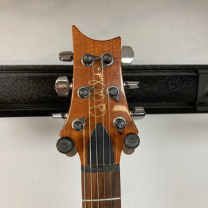 PRS 1996 Gold Top guitar headstock with tuning pegs, showcasing its vintage charm and meticulous craftsmanship.