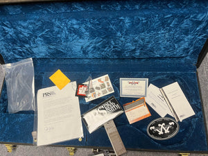 Open the blue velvet case for your PRS P22 Artisan Piezo Green Fade 2013 Brazilian Rosewood, featuring documentation, tags, warranty card, picks, sticker, cleaning cloth, and bag—ideal for this piezo electric guitar with humbuckers.