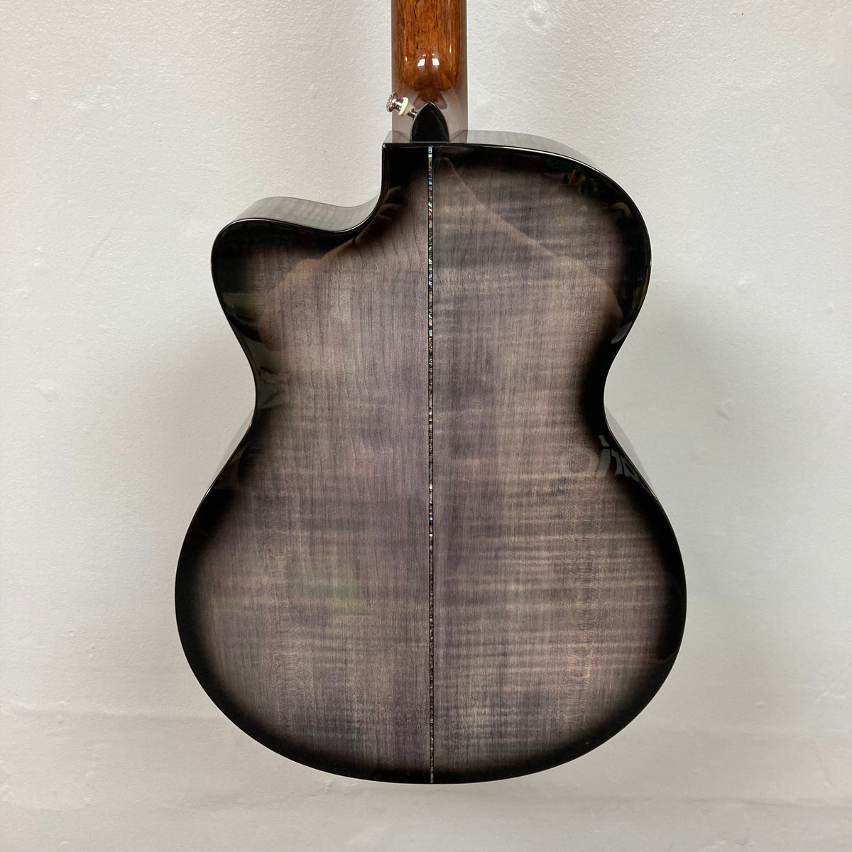 Close-up of PRS SE A50E guitar, highlighting its solid spruce top, maple back and sides, and Fishman GT1 pickup system.