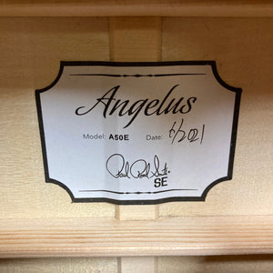 PRS SE A50E Charcoal Burst w/Case Used, featuring a close-up of the label and black handwritten text. Ideal for live performances with Fishman GT1 pickup system.