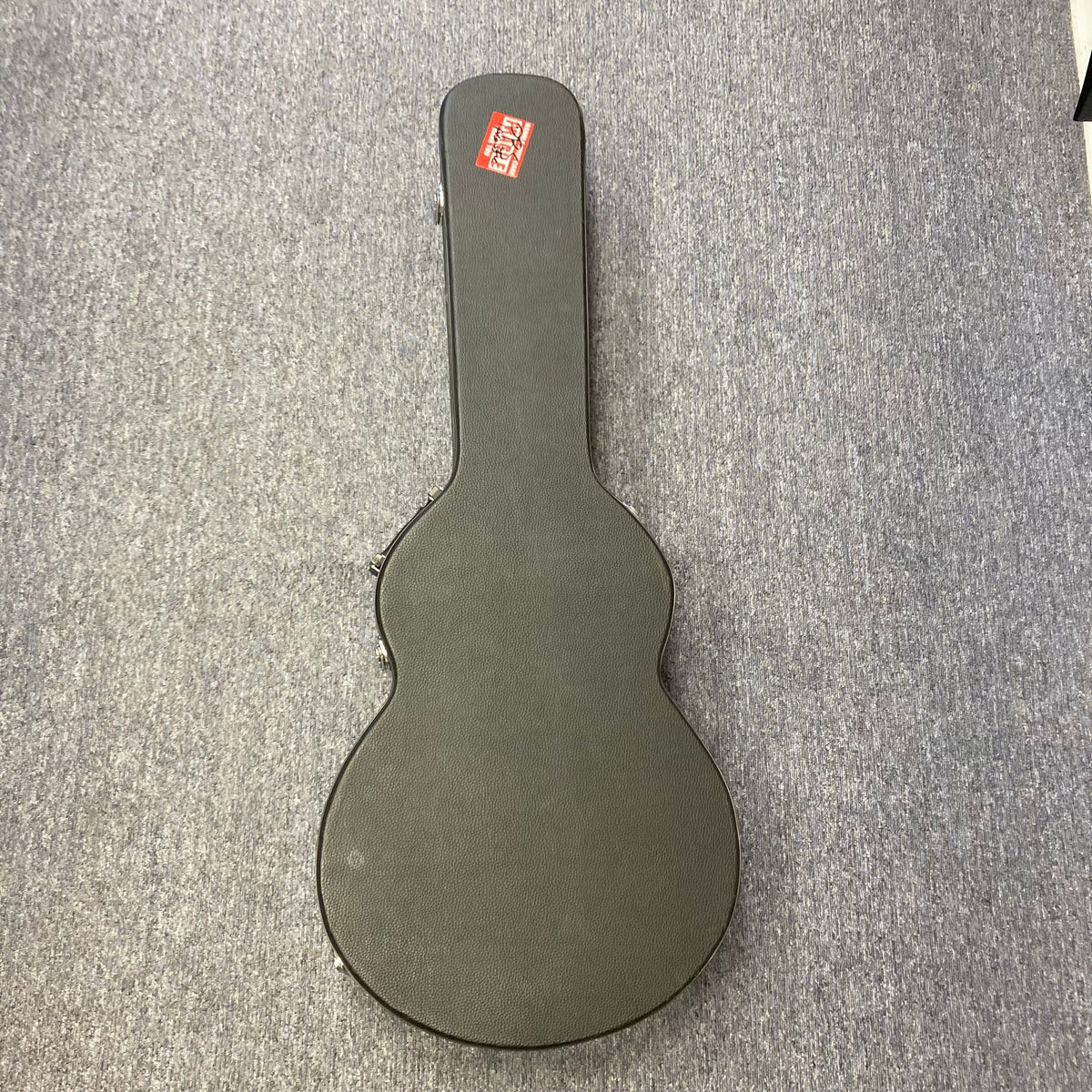 PRS SE A50E Charcoal Burst acoustic guitar in a black case on a carpet, featuring a maple back, spruce top, and Fishman GT1 pickup system.