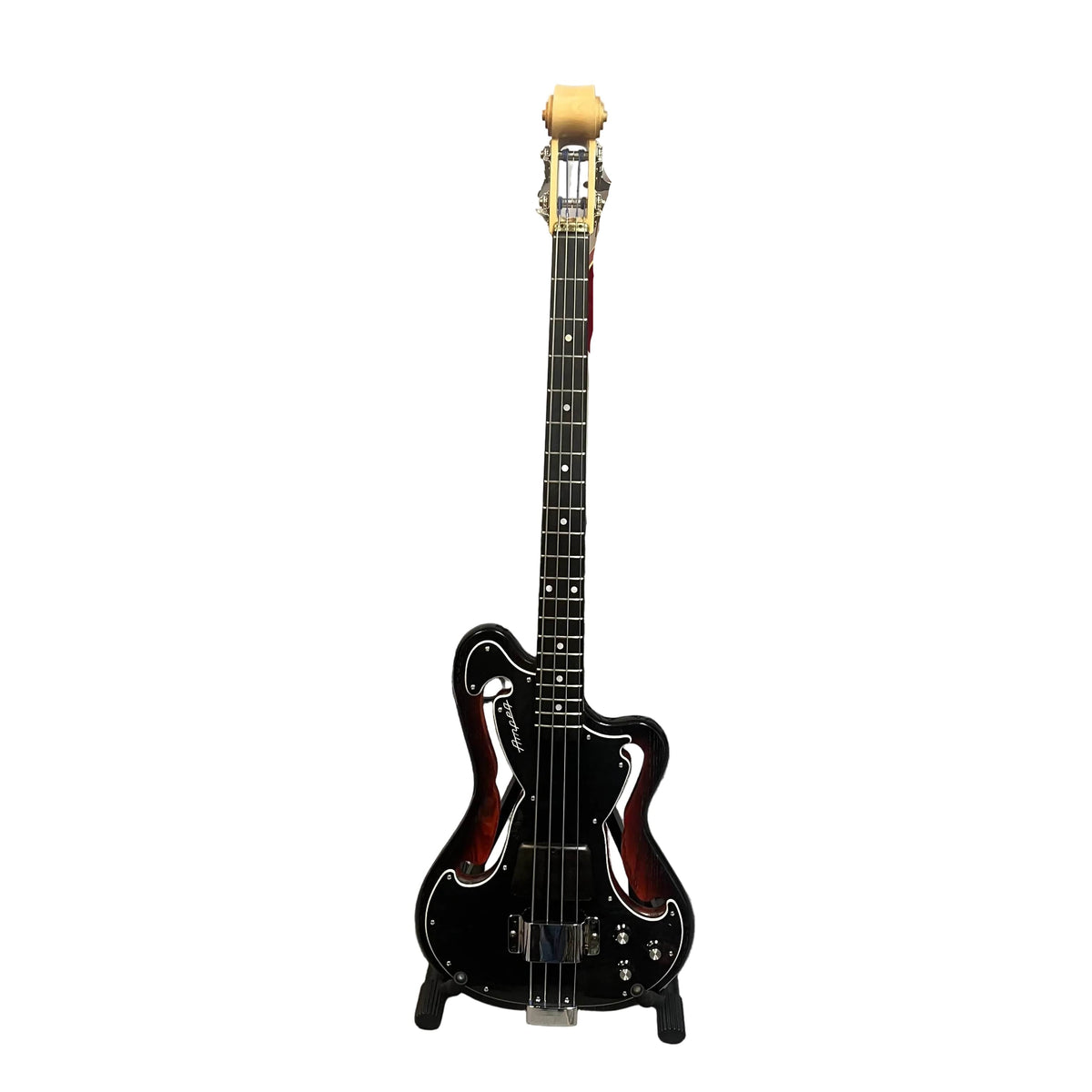 A rare Ampeg AEB-2 Scroll Top Bass, Serial #13 and a prototype-era Bruce Johnson build, stands upright on a stand against a white background—a collectible bass.