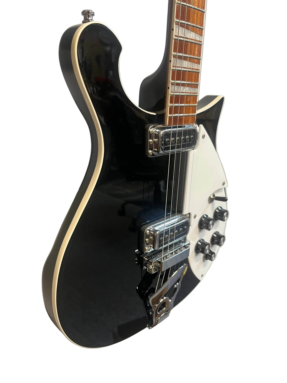 A near-mint Rickenbacker 620 in Jetglo finish with chrome hardware, white pickguard, and four control knobs is shown against a white background. Includes original case.