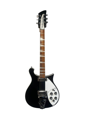 Near-mint Rickenbacker 620 – Jetglo six-string guitar with dual pickups, multiple control knobs, and a pointed headstock, shown upright against a white background. Includes original case.