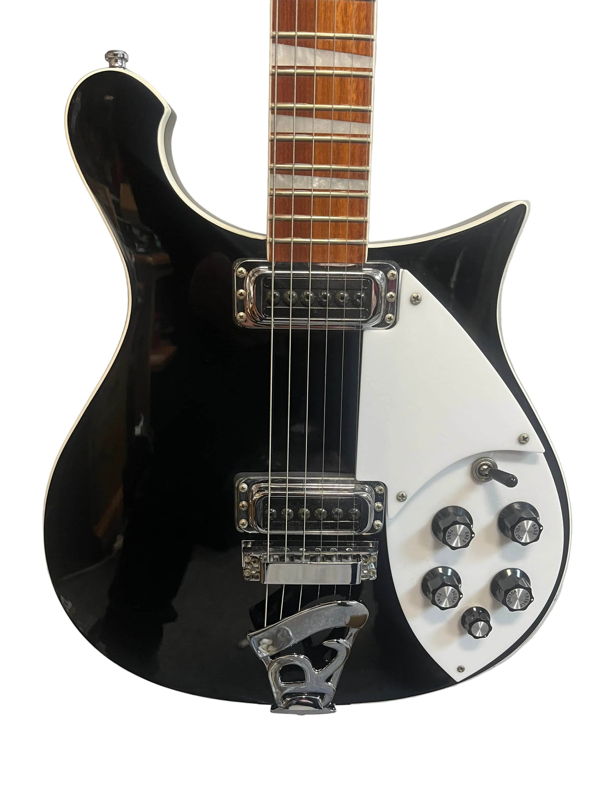 This near-mint Rickenbacker 620 Jetglo features a sleek black and white finish, white pickguard, six control knobs, two pickups, wooden fretboard, and comes with the original case.