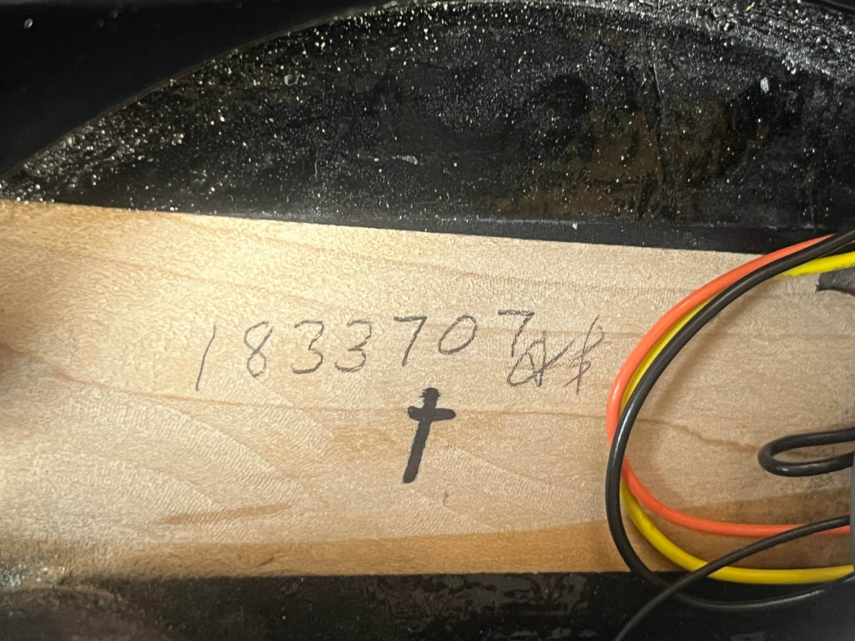 A wood piece labeled 1833707 with a cross and wires, likely from a near mint Rickenbacker 620 collector guitar in Jetglo finish, includes the original case.