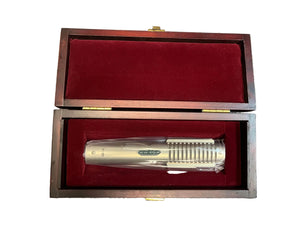 A pre-owned Royer Labs R-121 Ribbon Microphone in excellent condition sits in a red velvet-lined wooden box with an open lid, perfect for your next studio recording session.