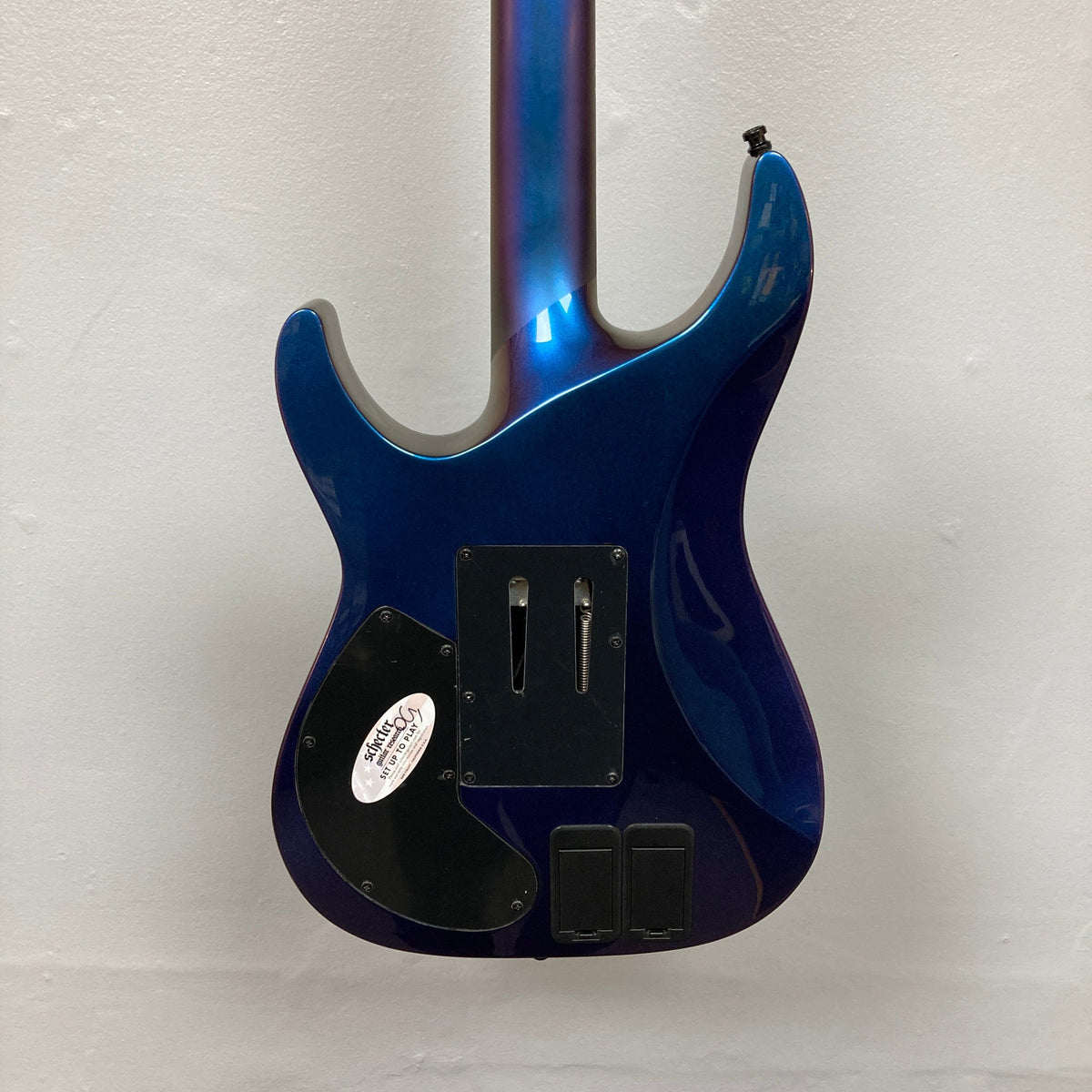 Schecter Hellraiser Hybrid C-1 FR S Sustainiac guitar showing ultra-thin C maple neck and Floyd Rose tremolo, highlighting its versatile and advanced features.