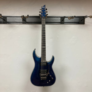 Schecter Hellraiser Hybrid C-1 FR S Sustainiac Ultra Violet Used, a blue electric guitar with prominent neck and pickups, displayed against a plain backdrop.
