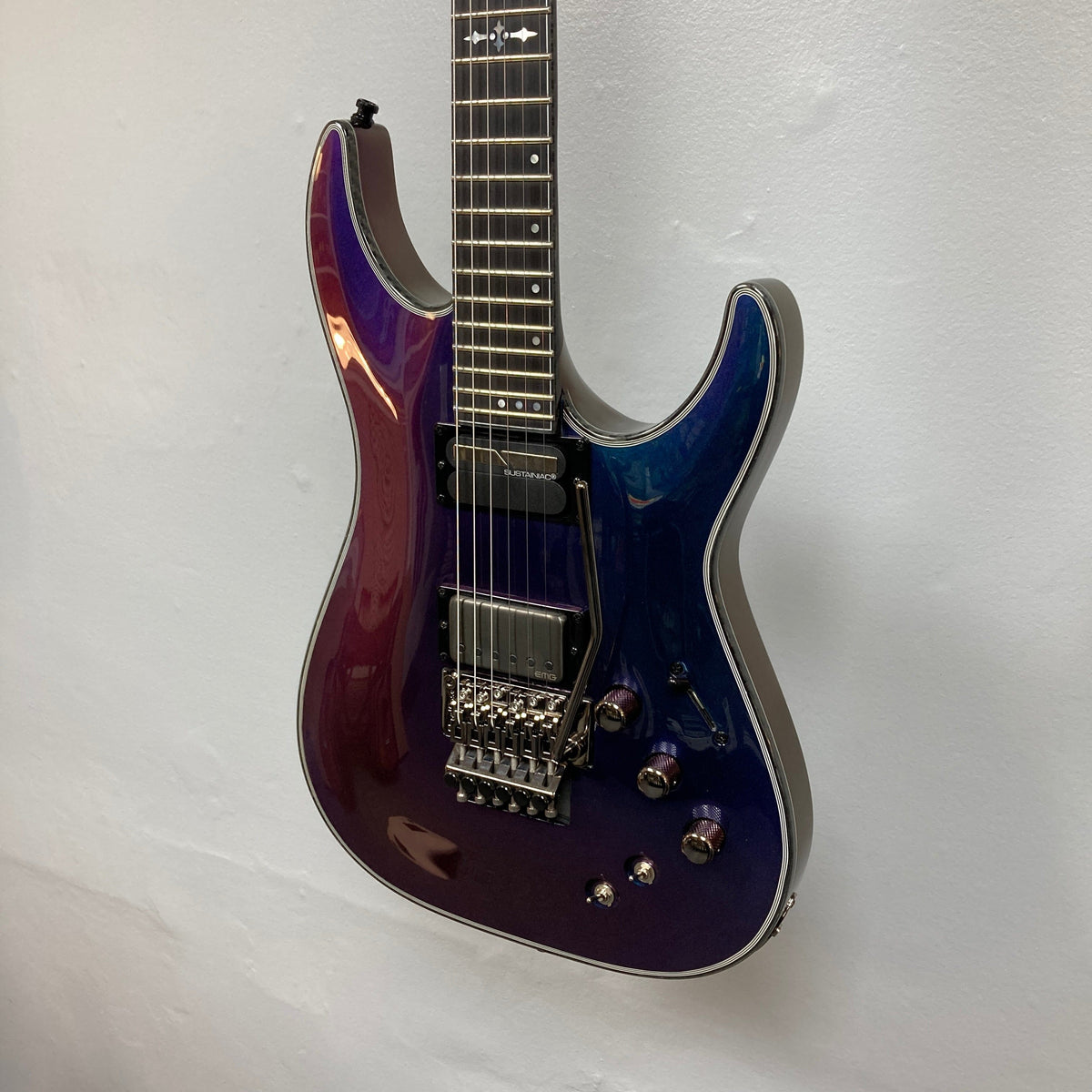 Schecter Hellraiser Hybrid C-1 FR S Sustainiac Ultra Violet guitar with carbon fiber binding, showcasing its sleek design and advanced features for versatile playability.