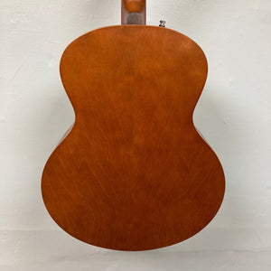 Seagull Entourage Mini Jumbo Rustic Burst MJ guitar close-up, highlighting its wooden body and refined cream binding.