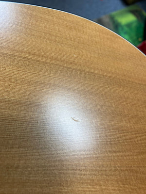 Close-up of a Seagull S6 Original Left Handed Acoustic Guitar (Blemished) by Seagull, featuring a cedar top with visible wood grain, light reflection, and a small dent or scratch in the finish near the center.