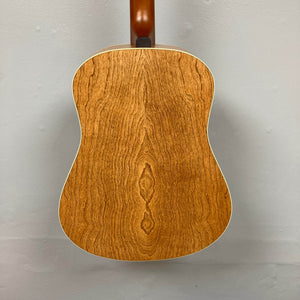 The Seagull S6 QI Slim Acoustic Guitar w/Hard Case - USED/consign showcases its natural wood grain back against a gray background, highlighting Seagull’s craftsmanship in a travel-friendly instrument ideal for musicians on the move.