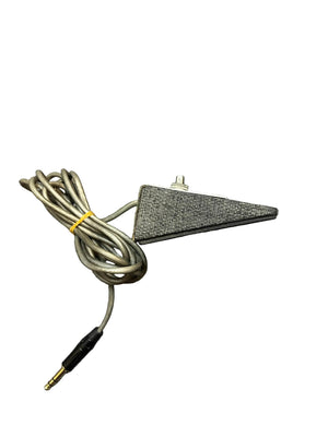 The Silvertone 1484 Tremolo Reverb Footswitch (1960s, Gray) is a wired, triangle-shaped device with a fabric cover and coiled cable that ends in a 3.5mm audio jack.