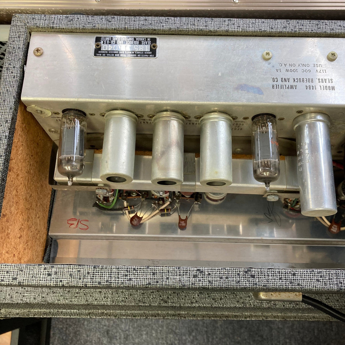 Silvertone Model 1484 Twin Twelve 60-Watt 2x12 Guitar Amp with tubes, wires, and metal components showcasing vintage design and powerful performance.