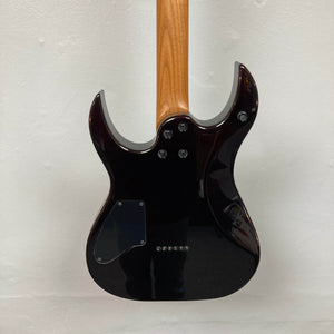 The back of the Spira S-450 Trans Green TGR electric guitar by Spira is shown, highlighting its neck joint, back plate, and string ferrules, all set against a plain light-colored wall.