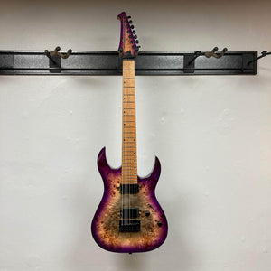 Spira S-457 TPP Trans Purple Burst electric guitar, seven-string, double-cutaway design with burl top, humbuckers, fixed bridge, and locking machine heads on wall rack.