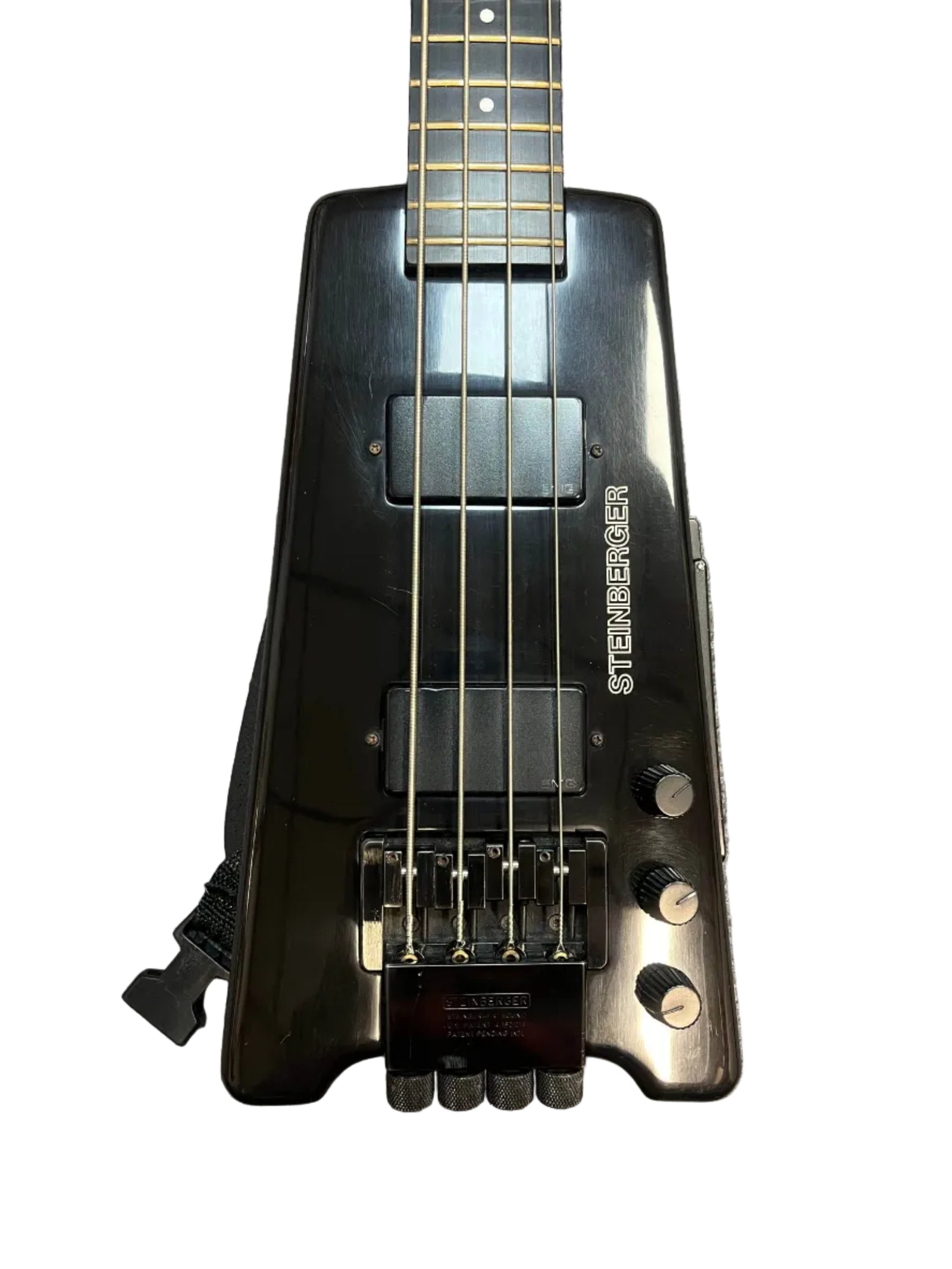 Close-up of a 1984 Steinberger XL-2 Bass USA, an iconic black headless bass, highlighting its pickups, bridge, control knobs, and part of the neck against a white background. Close-up of a 1984 Steinberger XL-2 Bass USA, an iconic black headless bass, highlighting its pickups, bridge, control knobs, and part of the neck against a white background.