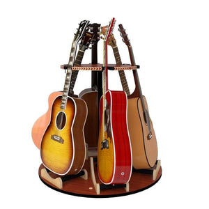The Carousel™ Deluxe Rotating Guitar Stand by A&S Crafted Products holds six acoustic guitars upright in a circular, space-saving design, displaying instruments of various colors and styles.