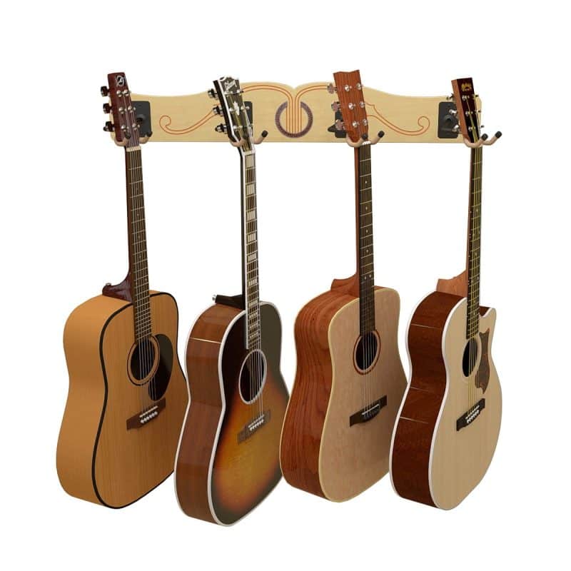 Four acoustic guitars in assorted finishes hang on the A&S Crafted Products Pro-File™ Wall-Mounted Guitar Hanger, creating a stylish wall display against a decorative wooden backdrop.