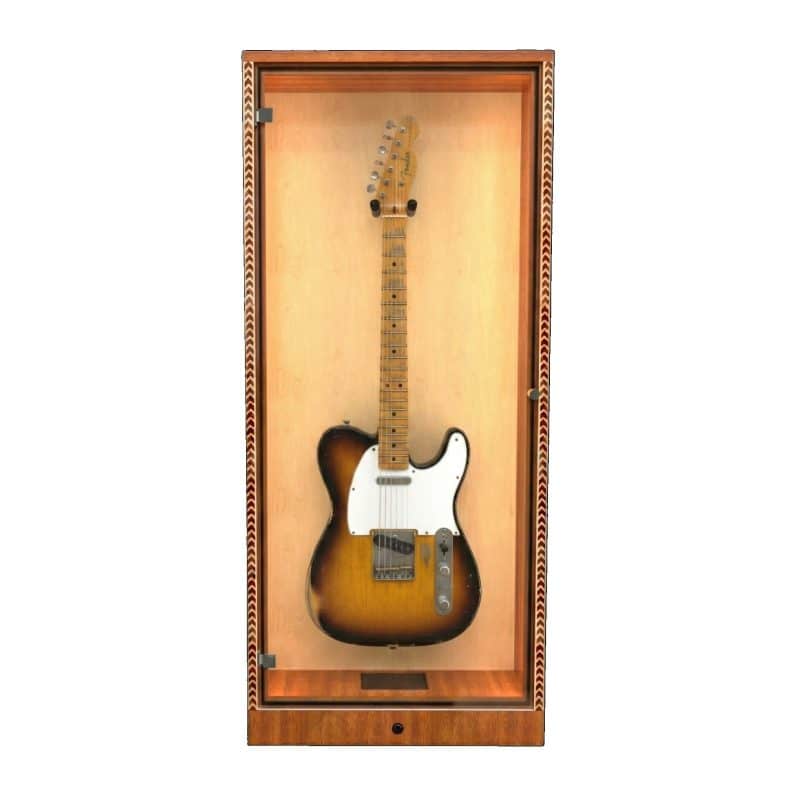 A sunburst acoustic guitar is showcased vertically in The ShowCase™ Deluxe Lockable Guitar Display Cabinet by A&S Crafted Products, blending wood and glass with decorative trim for elegance and secure display. A sunburst acoustic guitar is showcased vertically in The ShowCase™ Deluxe Lockable Guitar Display Cabinet by A&S Crafted Products, blending wood and glass with decorative trim for elegance and secure display.