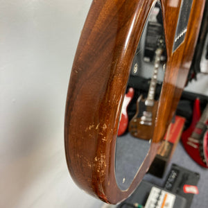 Travis Bean TB1000A Artist 1970s guitar close-up, showcasing aluminum neck and original components, with visible wear and vintage case.
