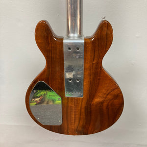 Travis Bean TB1000A Artist Natural 1970s guitar, close-up showing aluminum neck and original pickups, with vintage case included.