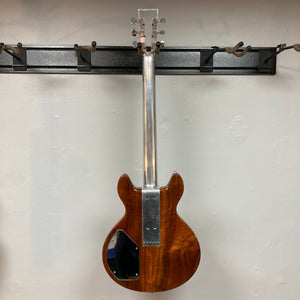 Travis Bean TB1000A Artist Natural 1970s guitar with aluminum neck and original pickups, mounted on a wall.