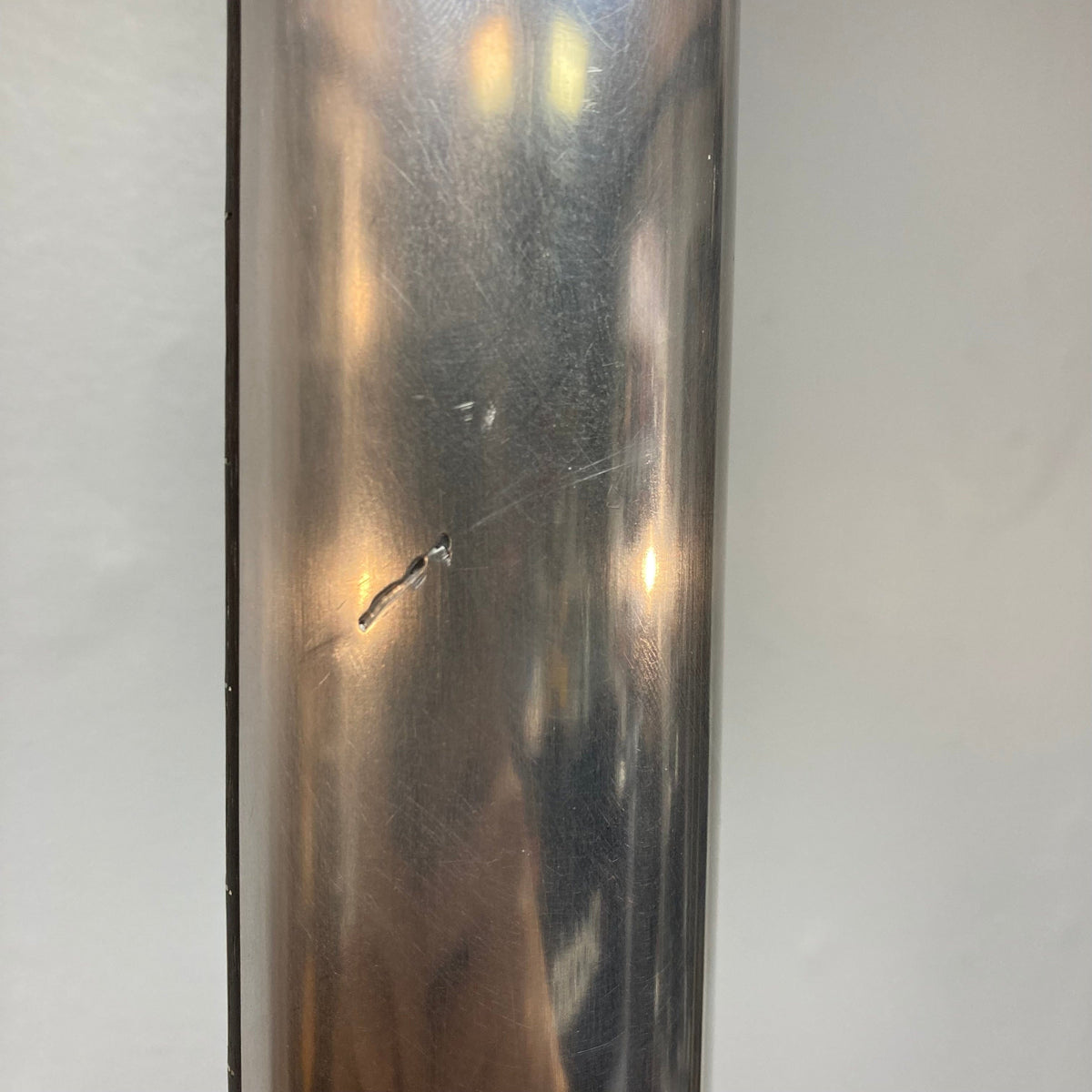 Close-up of the Travis Bean TB1000A Artist Natural 1970s guitar's aluminum neck and metal surface, highlighting its craftsmanship and unique design.