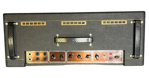 Rear view of a Vintage 1963 Vox AC30/6 Normal by Vox, featuring original JMI Egg Footswitch, flight case, Woden transformers, multiple jacks, control knobs, ventilation slots, and carrying handle.