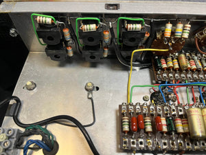 Close-up of the electronic circuit in a Vintage 1963 Vox AC30/6 Normal amp by Vox, featuring resistors, wires, capacitors, and terminal strips on a metal chassis; includes original JMI egg footswitch and flight case.