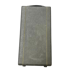 A vintage 1963 Vox AC30/6 Normal by Vox, featuring its original JMI egg footswitch and a textured gray rectangular flight case with yellow stripes and a top handle, shown against a white background.