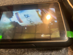 A close-up of a digital screen shows a blurry image of a white object labeled "25 OHM," reminiscent of markings inside a vintage Marshall 1971 50W Lead Head JMP Era amp, complete with flight case.