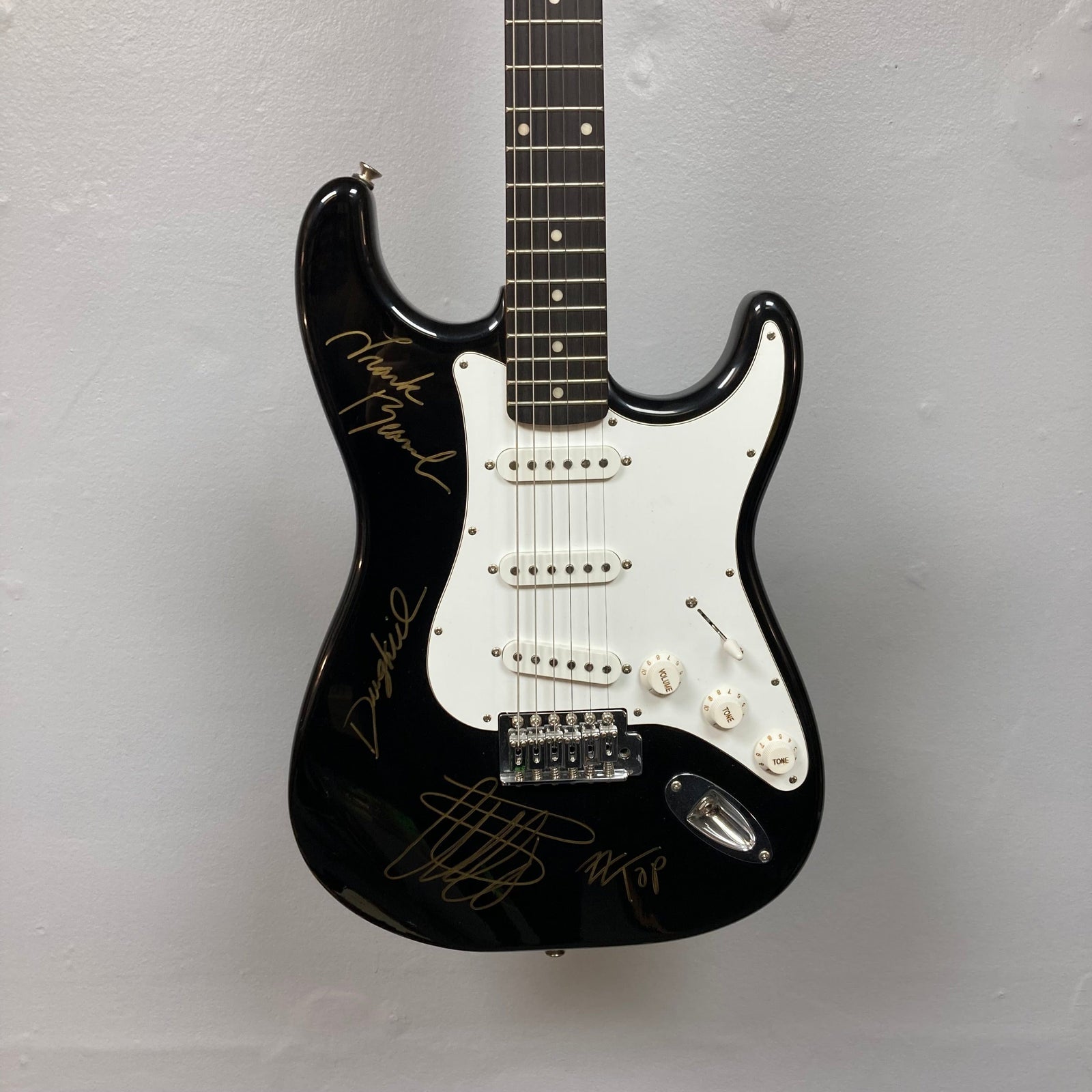 ZZ Top Signed Strat Style Guitar with autographs, featuring black and white design, available exclusively at Guitars on Main. ZZ Top Signed Strat Style Guitar with autographs, featuring black and white design, available exclusively at Guitars on Main.