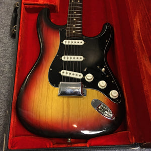 1976 Fender Strat Sunburst guitar in original case with paperwork; close-up details of knobs, strings, and neck. All original parts, great condition.