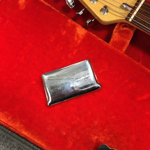 1976 Fender Stratocaster Sunburst, all original with case and paperwork, displayed on a red velvet case, showcasing its pristine condition.