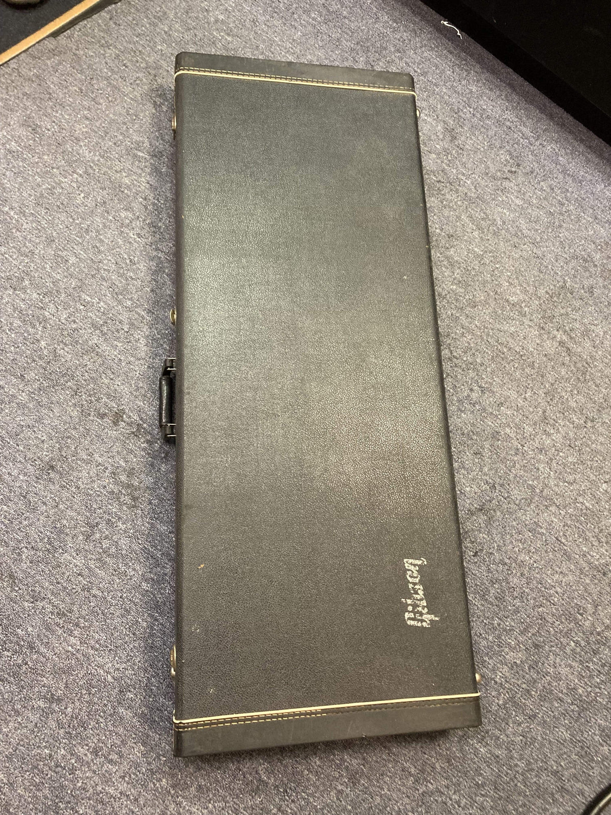 1980 Gibson EDS-1275 Double Neck Electric Guitar in original black leather case on a carpet.