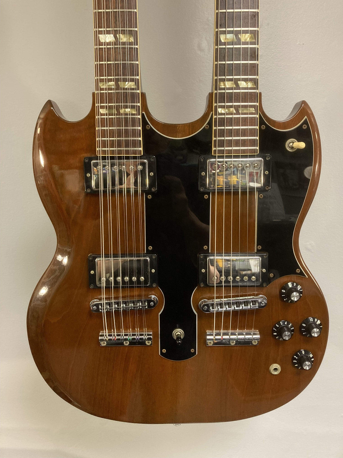 1980 Gibson EDS-1275 Double Neck Electric Guitar, close-up of strings and body, showcasing the craftsmanship and condition.