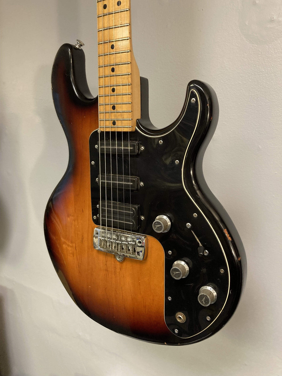 1980 Peavey T-27 Electric Guitar with double-cutaway body, maple neck, high gloss finish, and versatile blade-style pickups.