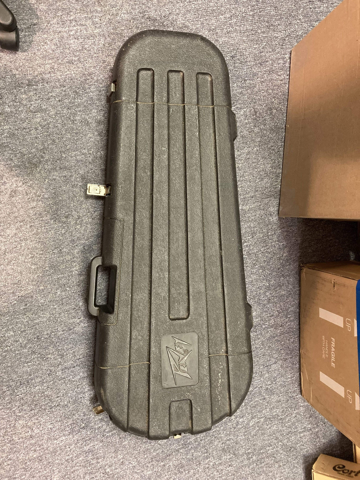 1980 Peavey T-27 Electric Guitar in a black case on a carpet.