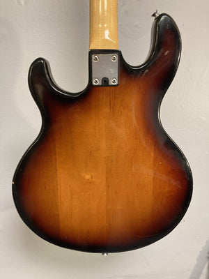 1980 Peavey T-27 Electric Guitar close-up, showcasing its double-cutaway body, maple neck, and high gloss finish with b/w/b pickguard.