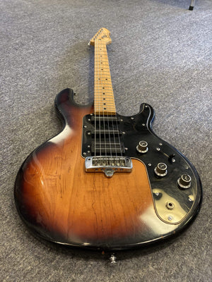 1980 Peavey T-27 Electric Guitar with double-cutaway body, maple neck, and high gloss finish, featuring blade-style humbuckers and single coils.