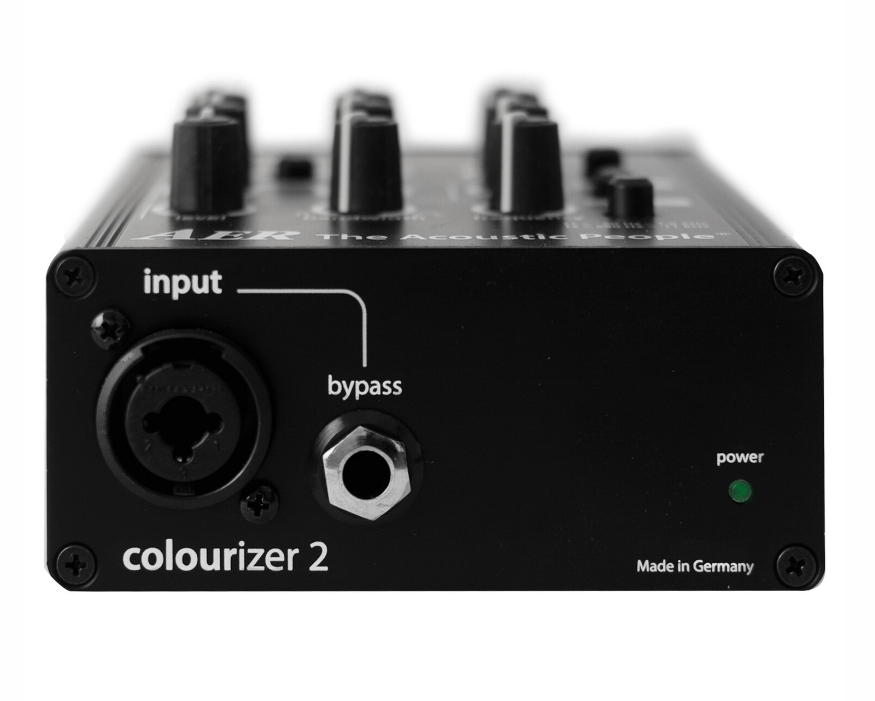 Close-up of the AER Colourizer 2 preamplifier, showcasing its compact, black design and control knobs for enhancing instrument and microphone sound quality.